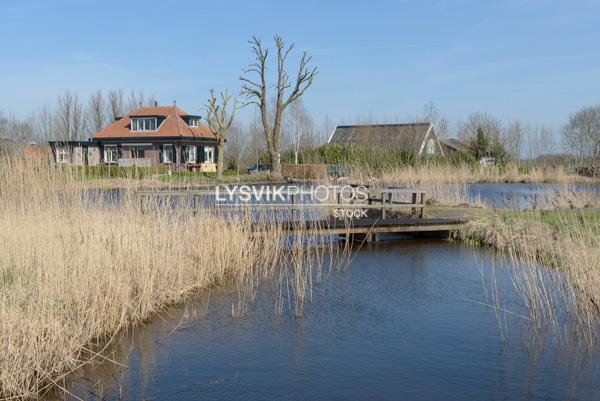 Doorkijkje op woonhuizen Bleskensgraaf [0010341]