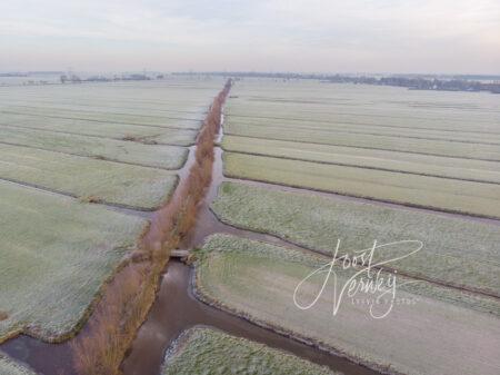 Luchtfoto winters polderlandschap